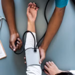nurse-measuring-patient-blood-pressure_53876-14933